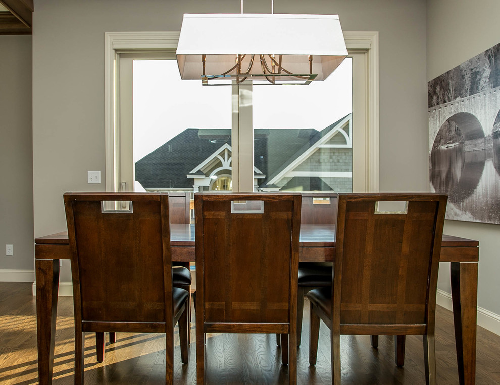 Inspiration for a transitional open plan dining in Minneapolis with grey walls and medium hardwood floors.