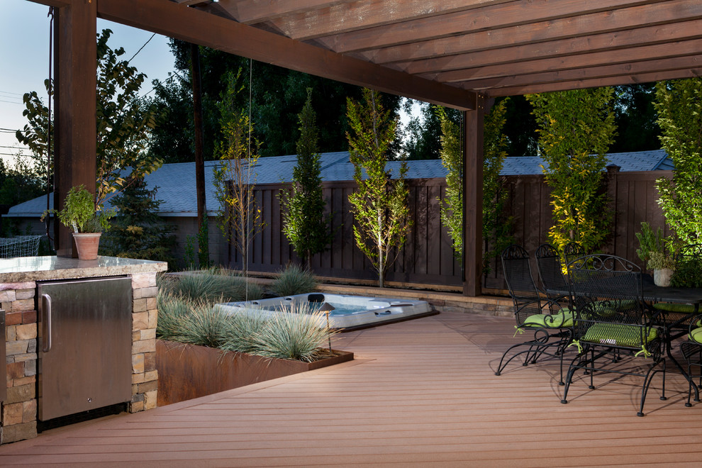 Inspiration for a modern backyard deck in Salt Lake City with a pergola.