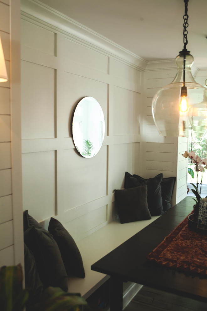 Example of a mid-sized transitional formal and open concept gray floor and medium tone wood floor dining room design in Omaha with white walls, no tv and no fireplace