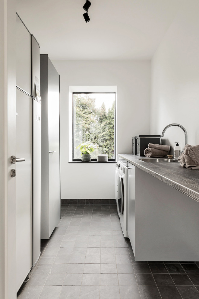 Inspiration for a contemporary laundry room in Stockholm.