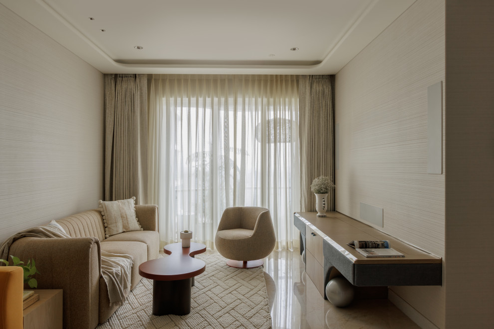 This is an example of a transitional living room in Mumbai With White Walls.