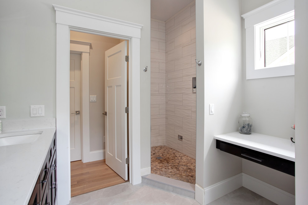 This is an example of a mid-sized country master bathroom in Boston with beaded inset cabinets, black cabinets, a freestanding tub, an alcove shower, a one-piece toilet, white walls, light hardwood floors, a drop-in sink, engineered quartz benchtops, white floor, an open shower, white benchtops, an enclosed toilet, a double vanity, a built-in vanity, vaulted and wood walls.