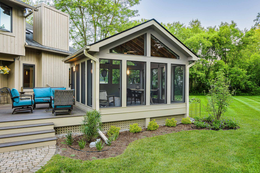 Mid-sized trendy screened-in back porch idea in Detroit with decking and a roof extension