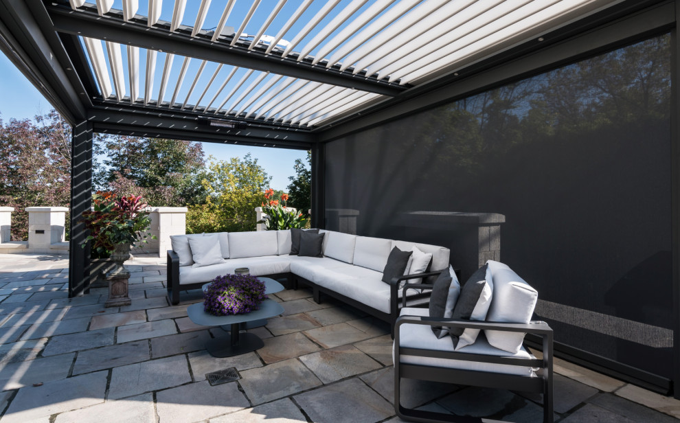Patio - large modern patio idea in Montreal with a pergola