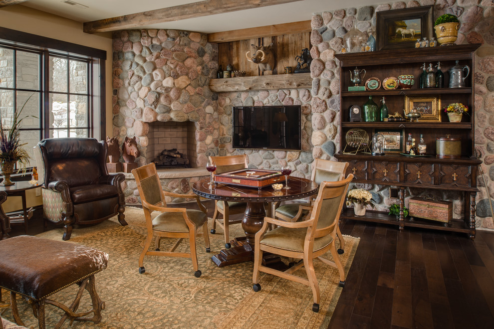 Design ideas for a traditional family room in Other with beige walls, dark hardwood floors, a stone fireplace surround, a wall-mounted tv and a corner fireplace.