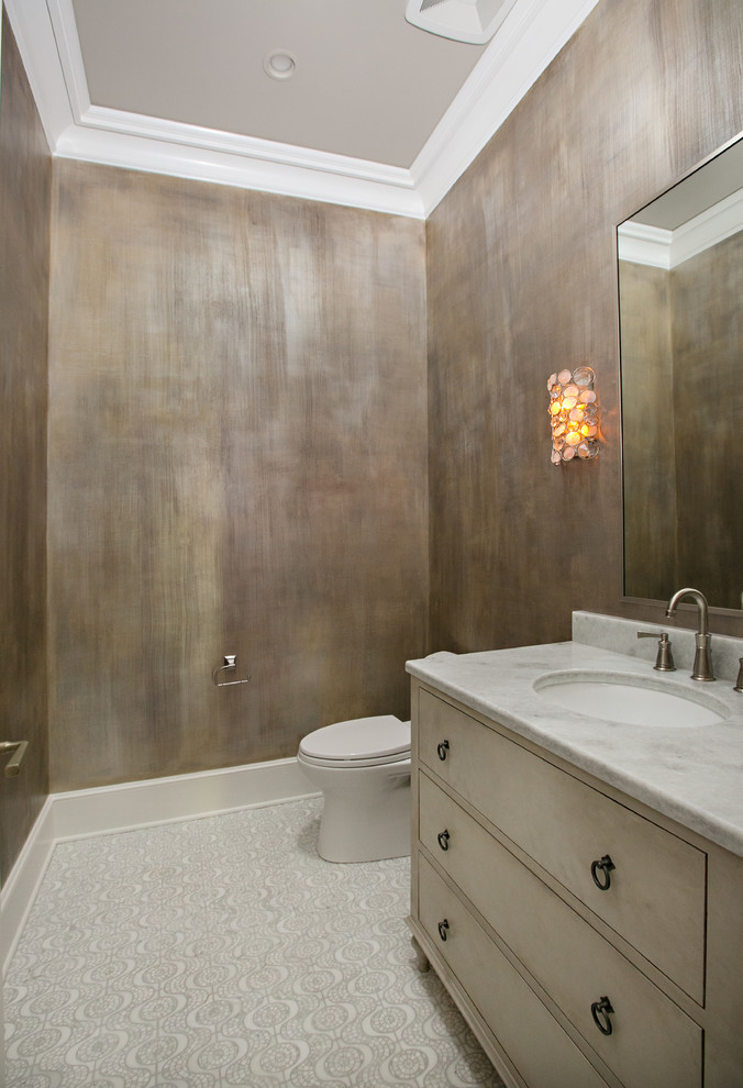 Photo of a mid-sized transitional powder room in New Orleans with light wood cabinets, a one-piece toilet, white tile, multi-coloured walls, mosaic tile floors, an undermount sink and quartzite benchtops.