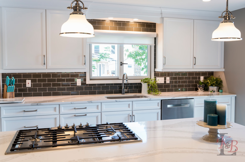 Eat-in kitchen - mid-sized transitional porcelain tile and brown floor eat-in kitchen idea with an undermount sink, recessed-panel cabinets, white cabinets, quartz countertops, gray backsplash, subway tile backsplash, stainless steel appliances, an island and white countertops