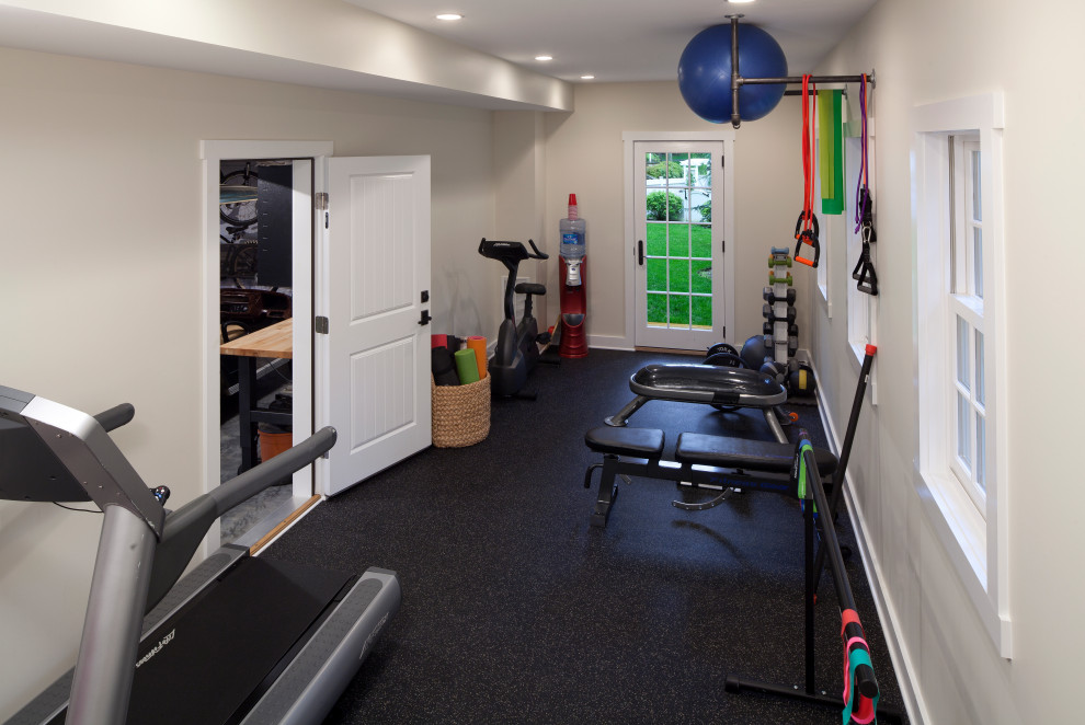 This is an example of a transitional multipurpose gym in Baltimore with beige walls and black floor.