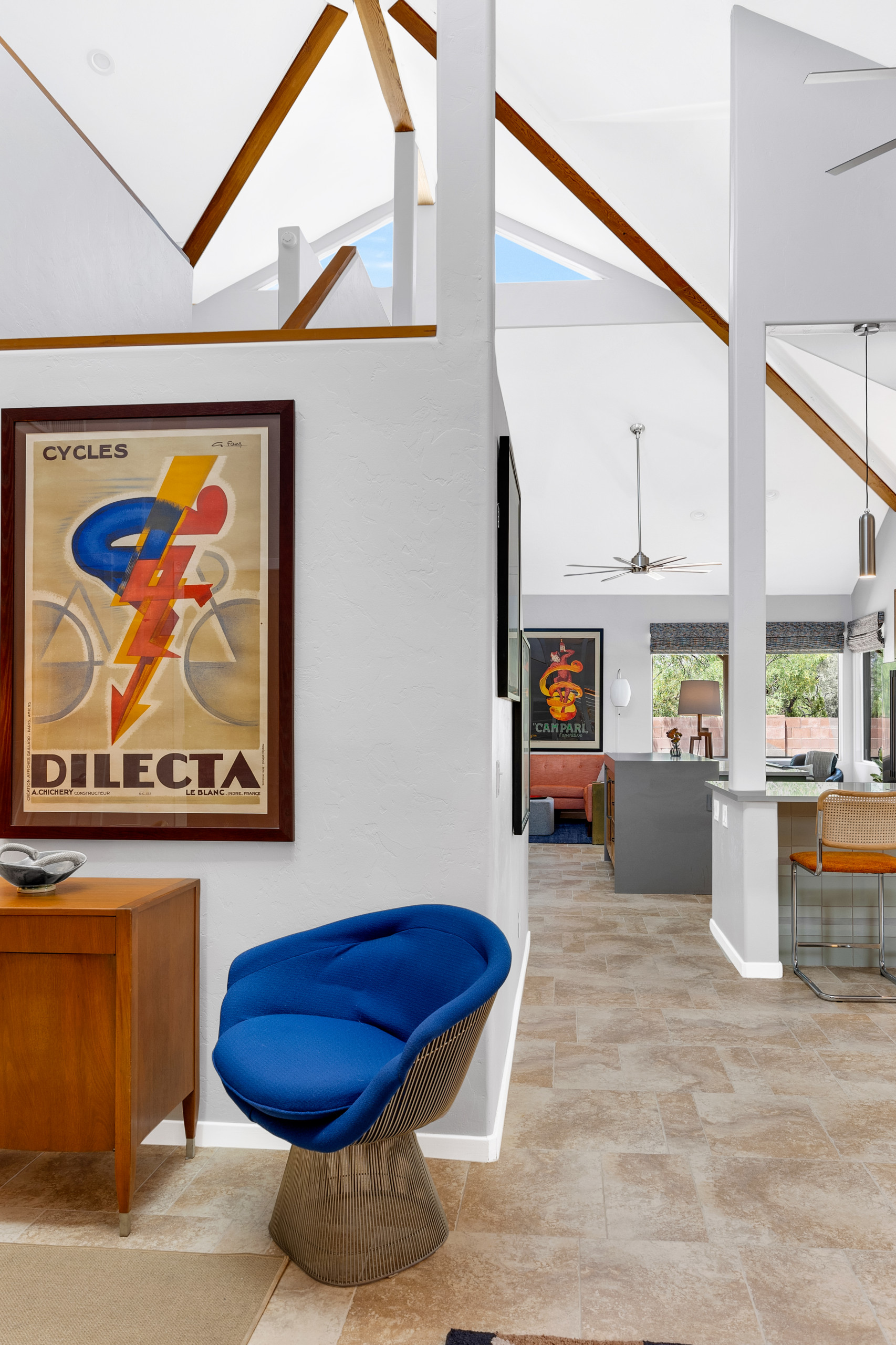 Make a grand entrance every day with this beautifully designed entryway. Featuring bold colors and unique decor. A locally-sourced vintage console hides shoes and slippers out of view.