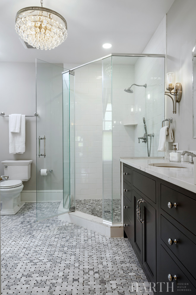 Bathroom - mid-sized transitional master white tile and porcelain tile marble floor, multicolored floor and single-sink bathroom idea in Philadelphia with beaded inset cabinets, gray cabinets, a two-piece toilet, gray walls, an undermount sink, quartz countertops, a hinged shower door, white countertops and a built-in vanity