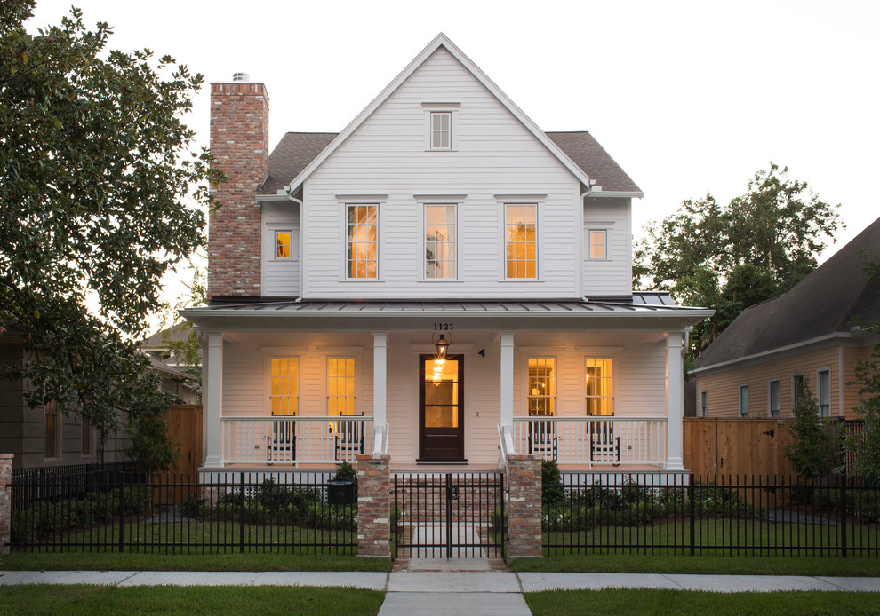 Design ideas for an expansive country two-storey white house exterior in Houston with a mixed roof and a brown roof.