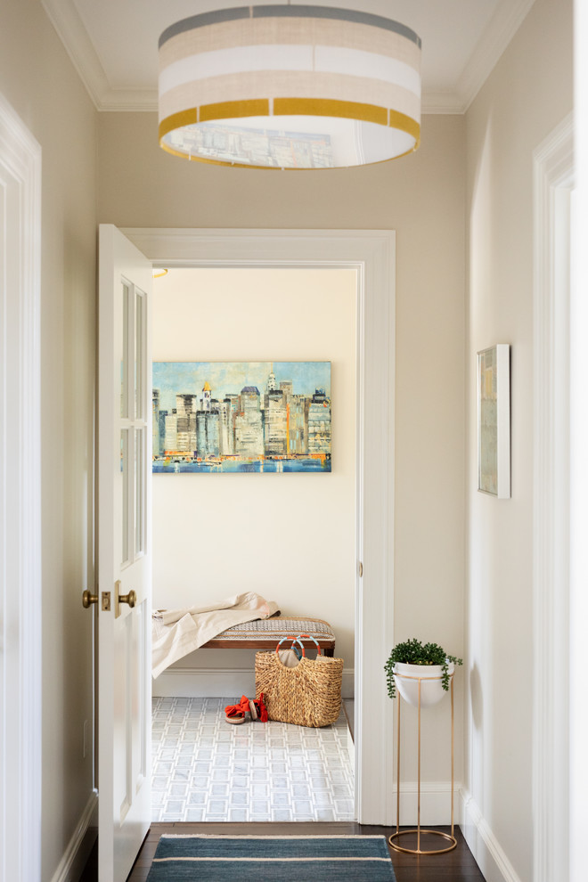 This is an example of a beach style hallway in Boston with dark hardwood floors.