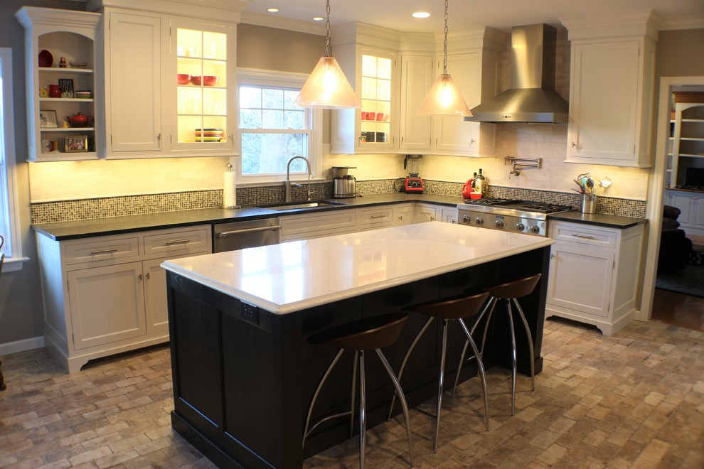 Example of a large trendy l-shaped porcelain tile eat-in kitchen design with recessed-panel cabinets, white cabinets, granite countertops, beige backsplash, an island, an undermount sink, porcelain backsplash and stainless steel appliances