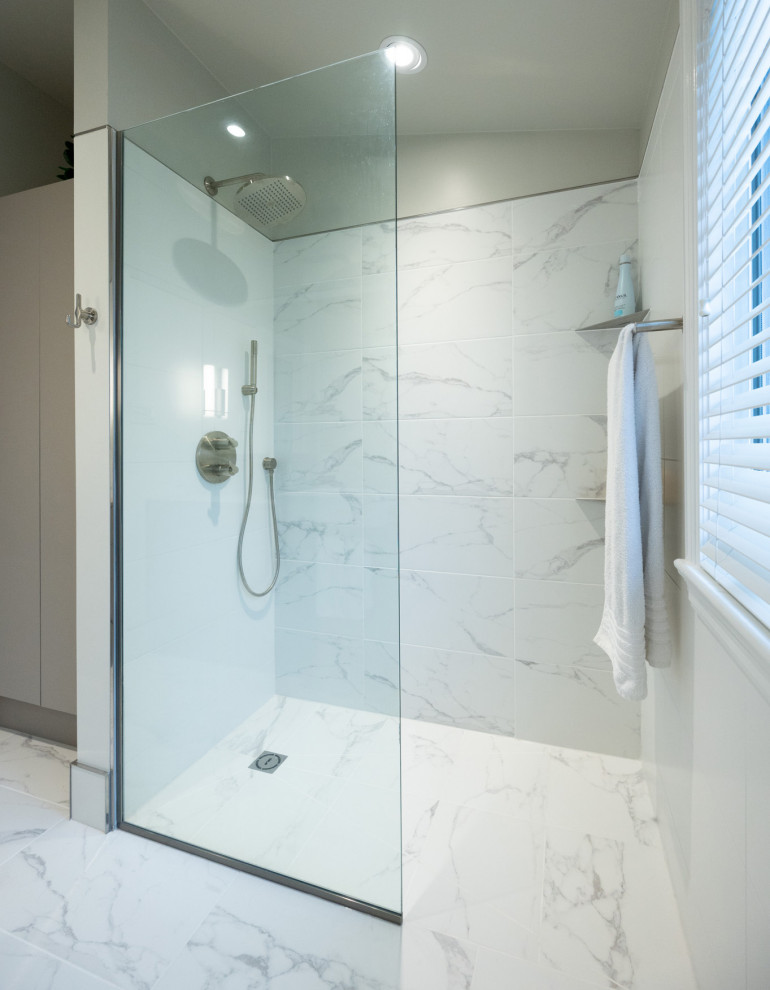 This is an example of a medium sized modern bathroom in Ottawa with flat-panel cabinets, grey cabinets, an alcove shower, white tiles, porcelain tiles, white walls, porcelain flooring, a vessel sink, laminate worktops, white floors, an open shower, grey worktops, a single sink and a floating vanity unit.