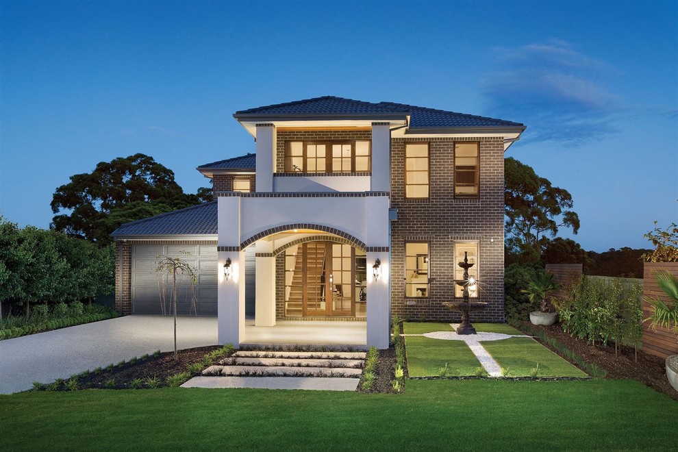 Photo of a large traditional two-storey brick brown exterior in Melbourne with a hip roof.