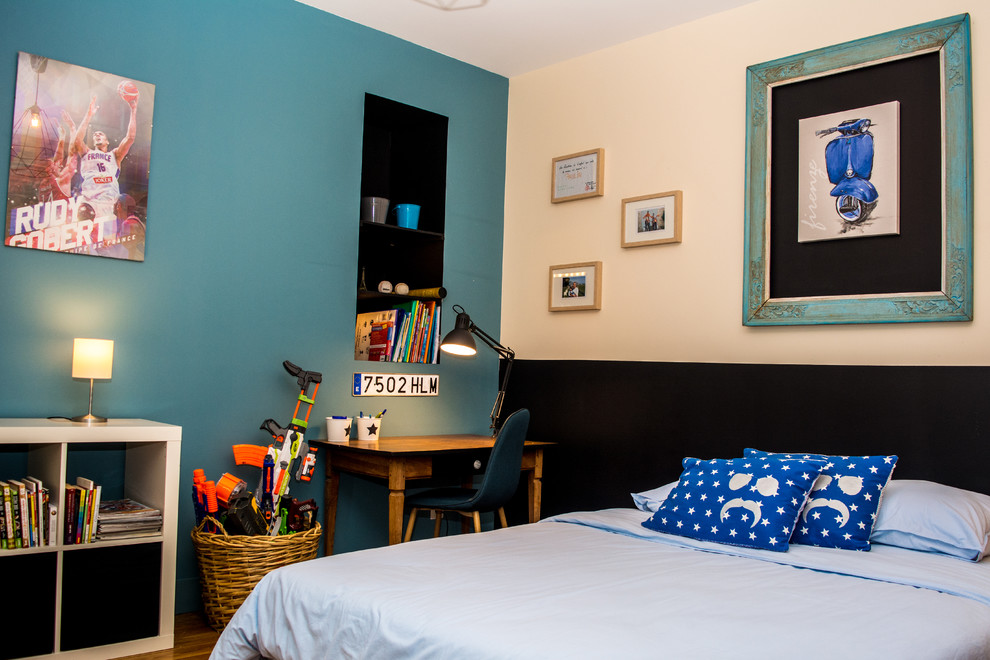 This is an example of a mid-sized contemporary kids' room for boys in Other with multi-coloured walls, dark hardwood floors and brown floor.