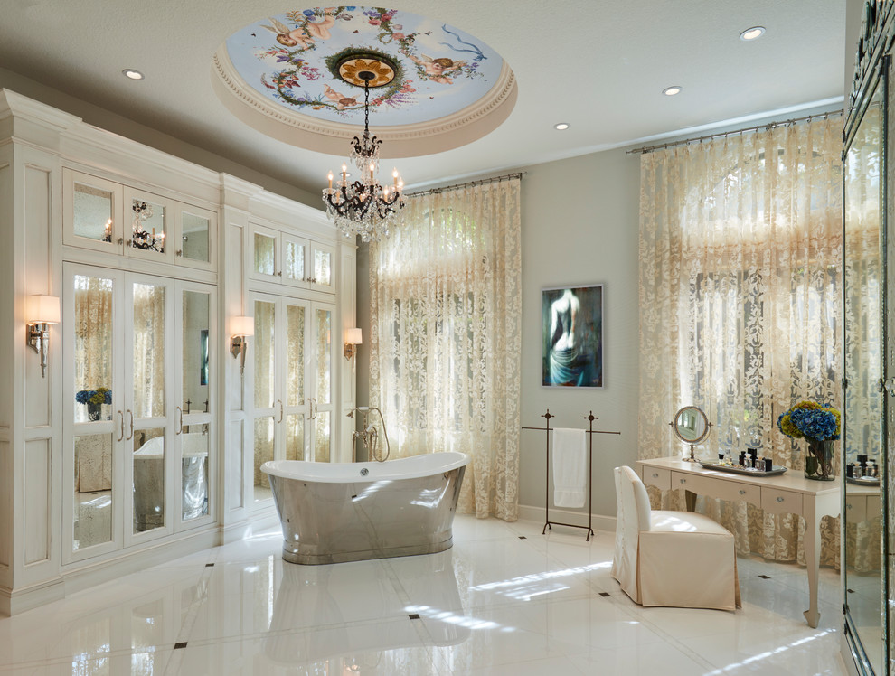 Inspiration for a traditional master bathroom in Miami with a freestanding tub, grey walls and multi-coloured floor.