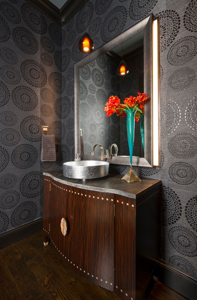 Photo of a mid-sized transitional powder room in Other with furniture-like cabinets, dark wood cabinets, grey walls, dark hardwood floors, a vessel sink, brown floor, marble benchtops and grey benchtops.