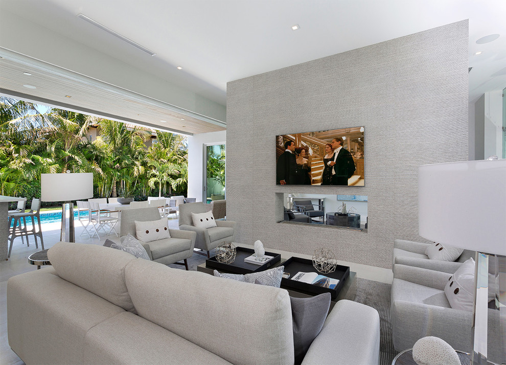 Mid-sized contemporary formal open concept living room in Other with beige walls, porcelain floors, a two-sided fireplace, a concrete fireplace surround, a wall-mounted tv and beige floor.