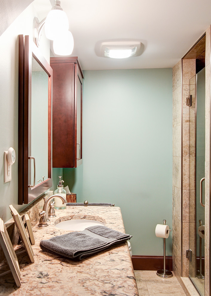 Example of a mid-sized transitional ceramic tile and beige tile ceramic tile and beige floor doorless shower design with recessed-panel cabinets, dark wood cabinets, a two-piece toilet, green walls, an undermount sink, quartzite countertops, a hinged shower door and multicolored countertops