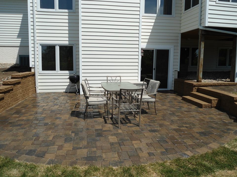 Photo of a traditional patio in Other with concrete pavers.