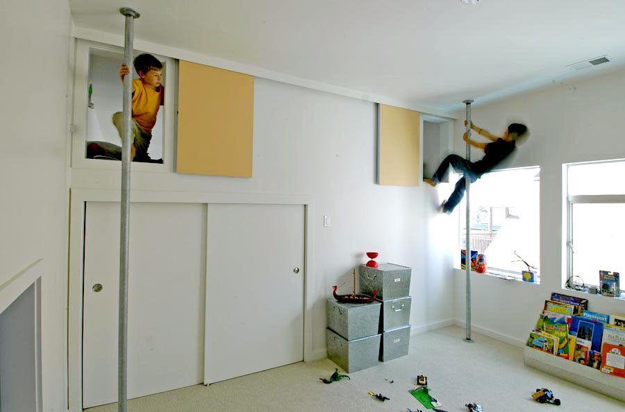 This is an example of a contemporary kids' playroom in San Francisco with white walls.