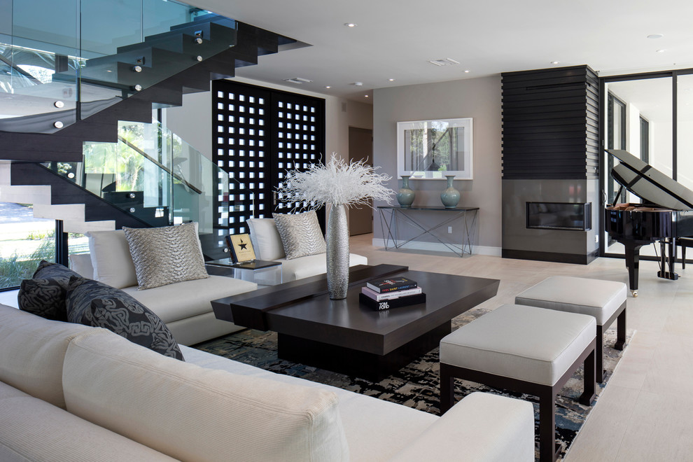 Inspiration for a contemporary open concept living room in Orlando with grey walls, a ribbon fireplace, a metal fireplace surround, no tv, a music area and beige floor.