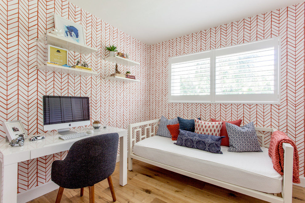 Example of a transitional girl medium tone wood floor kids' room design in Miami with multicolored walls