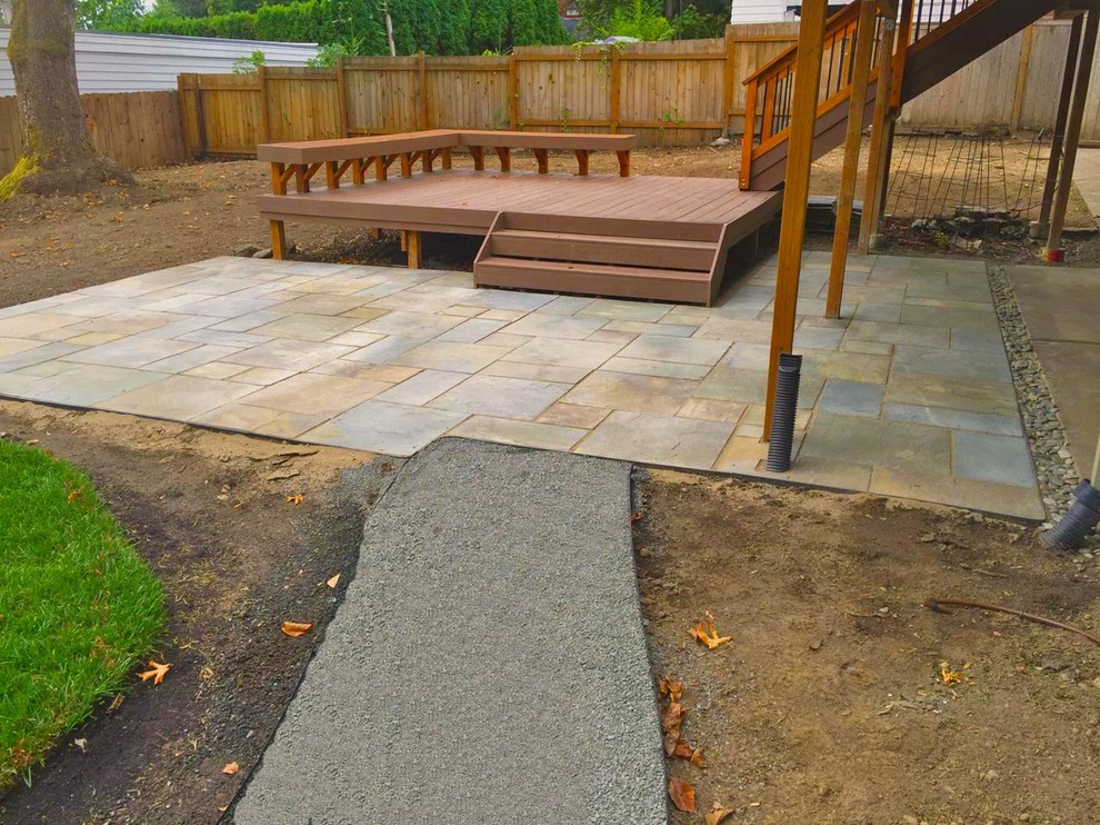 Inspiration for a mid-sized modern backyard garden in Portland with concrete pavers.