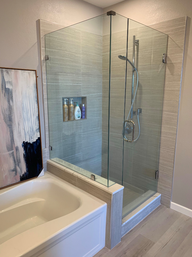Inspiration for a mid-sized transitional 3/4 bathroom in San Diego with shaker cabinets, white cabinets, an alcove tub, a corner shower, gray tile, porcelain tile, grey walls, light hardwood floors, an undermount sink, beige floor, a hinged shower door and white benchtops.