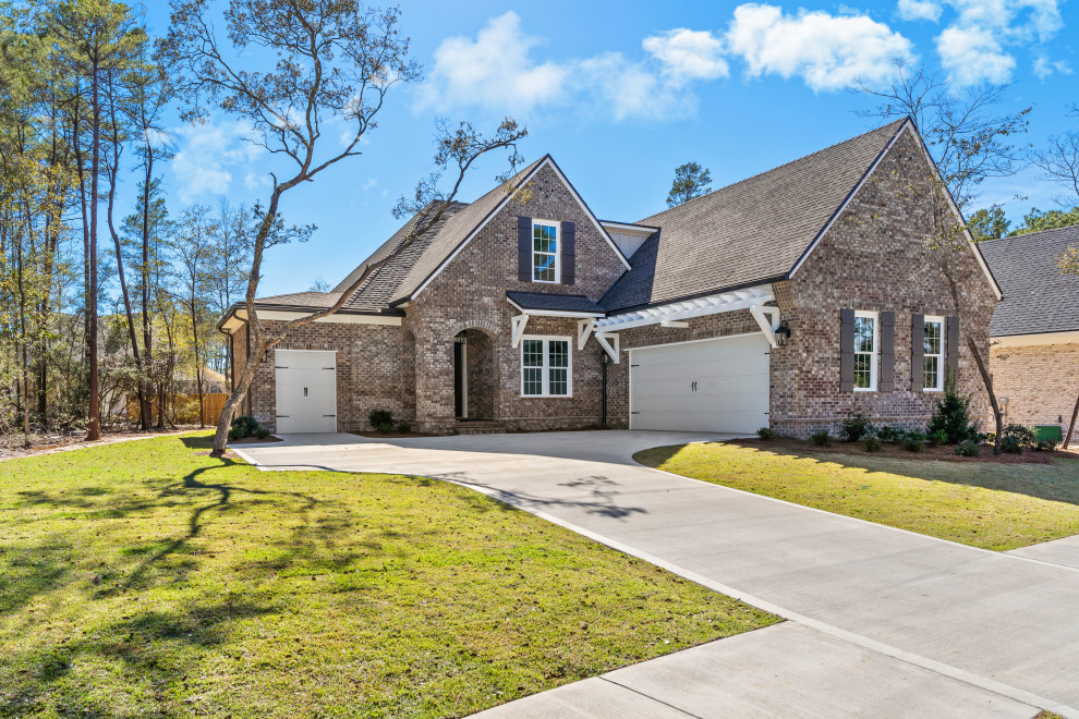 Inspiration for a transitional brown two-story brick house exterior remodel with a shingle roof
