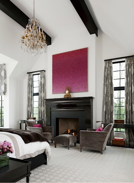 Inspiration for an expansive transitional master bedroom in Detroit with white walls, a standard fireplace, a wood fireplace surround and carpet.