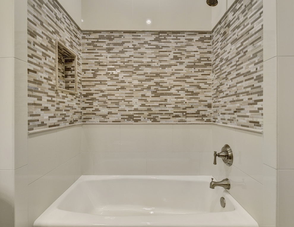 Inspiration for a mid-sized transitional kids bathroom in Austin with shaker cabinets, an alcove tub, a two-piece toilet, beige tile, mosaic tile, grey walls, porcelain floors, an undermount sink, white cabinets, a shower/bathtub combo, terrazzo benchtops, a shower curtain and brown floor.