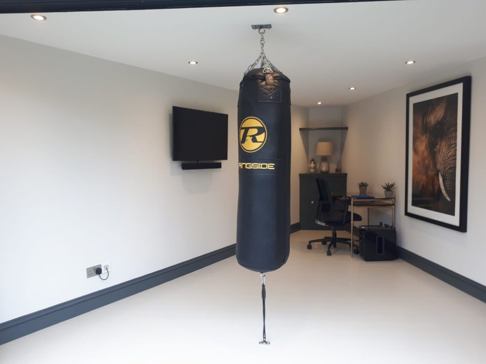 Mid-sized contemporary home gym in Surrey.