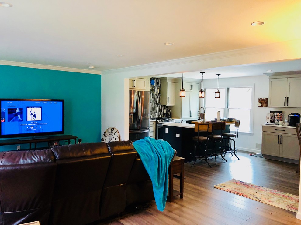 Inspiration for a mid-sized transitional bamboo floor and brown floor eat-in kitchen remodel with a farmhouse sink, shaker cabinets, gray cabinets, quartz countertops, multicolored backsplash, mosaic tile backsplash, stainless steel appliances, an island and white countertops