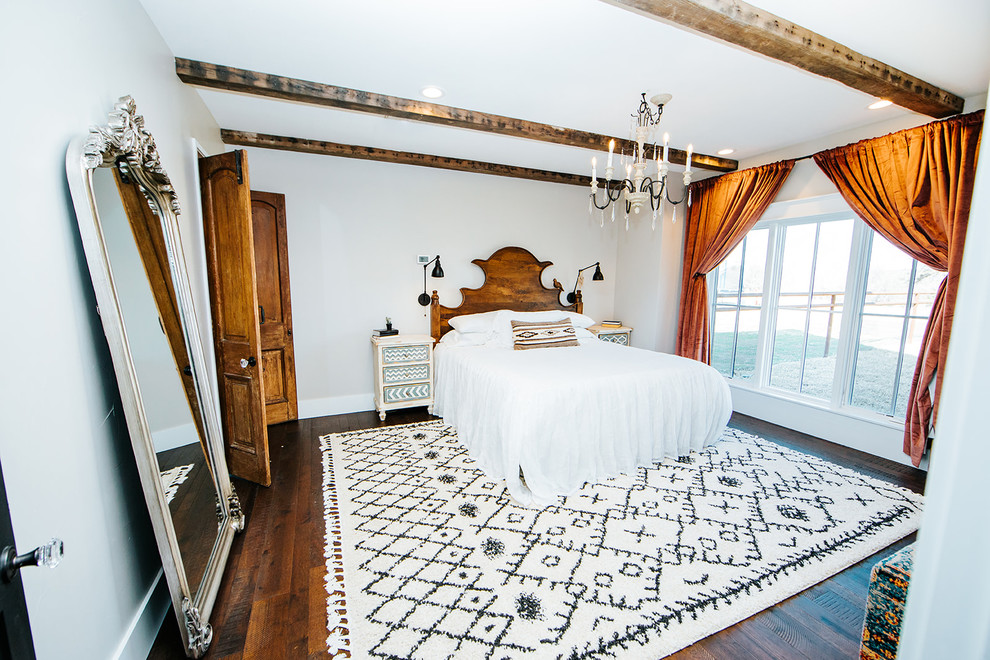 Design ideas for a country master bedroom in Austin with bamboo floors.