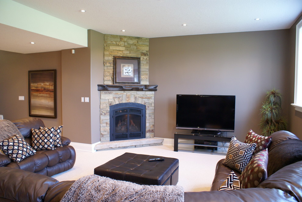 Inspiration for a large contemporary underground carpeted basement remodel in Other with brown walls, a corner fireplace and a stone fireplace