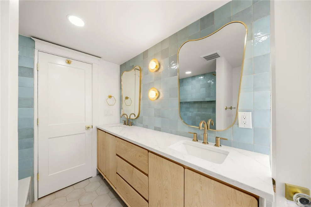 Custom tilework and modern fixtures elevate this bath retreat.