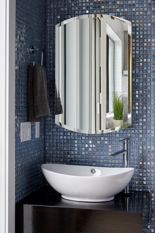 Contemporary powder room in Austin with dark wood cabinets and blue tile.