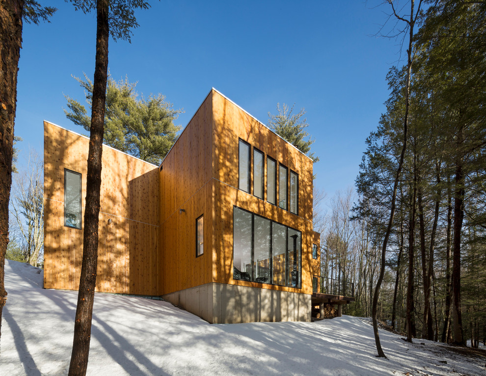 Photo of a contemporary exterior in New York with wood siding.