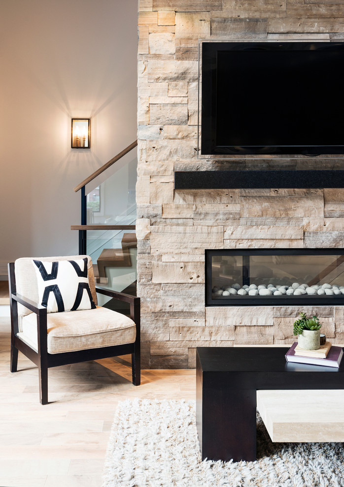 Design ideas for a large contemporary open concept living room in Toronto with white walls, ceramic floors, a two-sided fireplace, a stone fireplace surround and a wall-mounted tv.