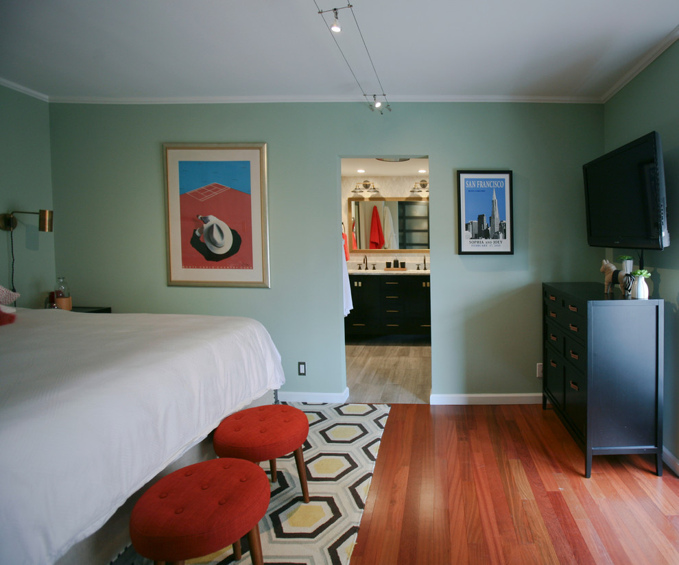 Mid-sized eclectic master bedroom in San Francisco with green walls, medium hardwood floors and no fireplace.