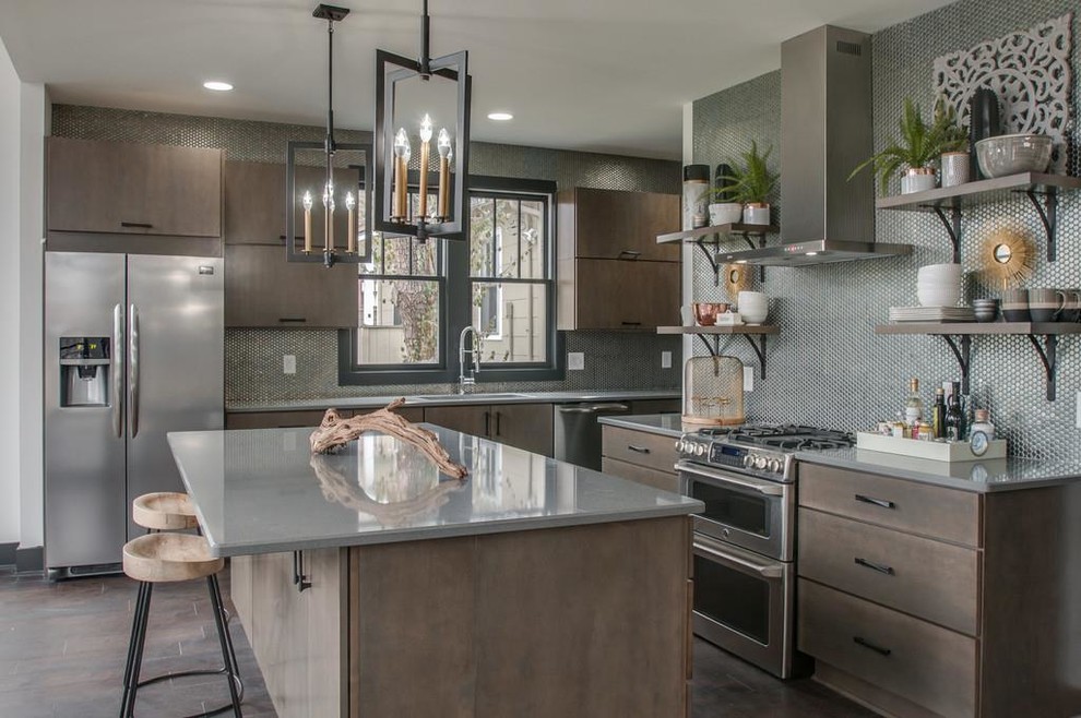 Inspiration for a large contemporary kitchen in Nashville with an undermount sink, flat-panel cabinets, quartz benchtops, metallic splashback, stainless steel appliances, porcelain floors, with island, brown floor, grey benchtop, metal splashback and dark wood cabinets.