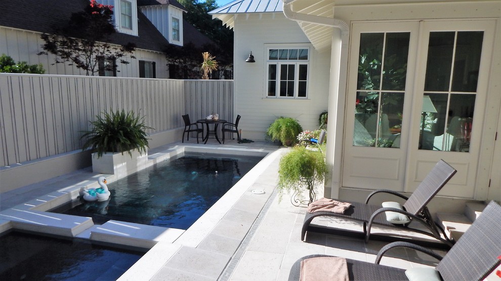 Small traditional backyard l-shaped pool in Miami with a hot tub and tile.
