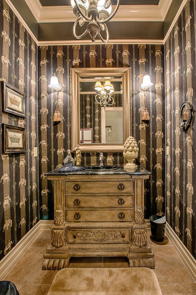 Inspiration for a traditional powder room in Seattle with a drop-in sink, furniture-like cabinets, medium wood cabinets, multi-coloured walls and black benchtops.