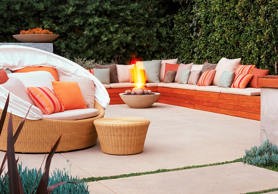 Design ideas for a large contemporary backyard patio in Los Angeles with a fire feature, concrete slab and no cover.