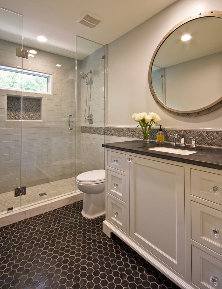 Design ideas for a mid-sized traditional master bathroom in Phoenix with recessed-panel cabinets, white cabinets, an alcove shower, gray tile, marble, grey walls, an undermount sink, soapstone benchtops, a hinged shower door, porcelain floors and black floor.