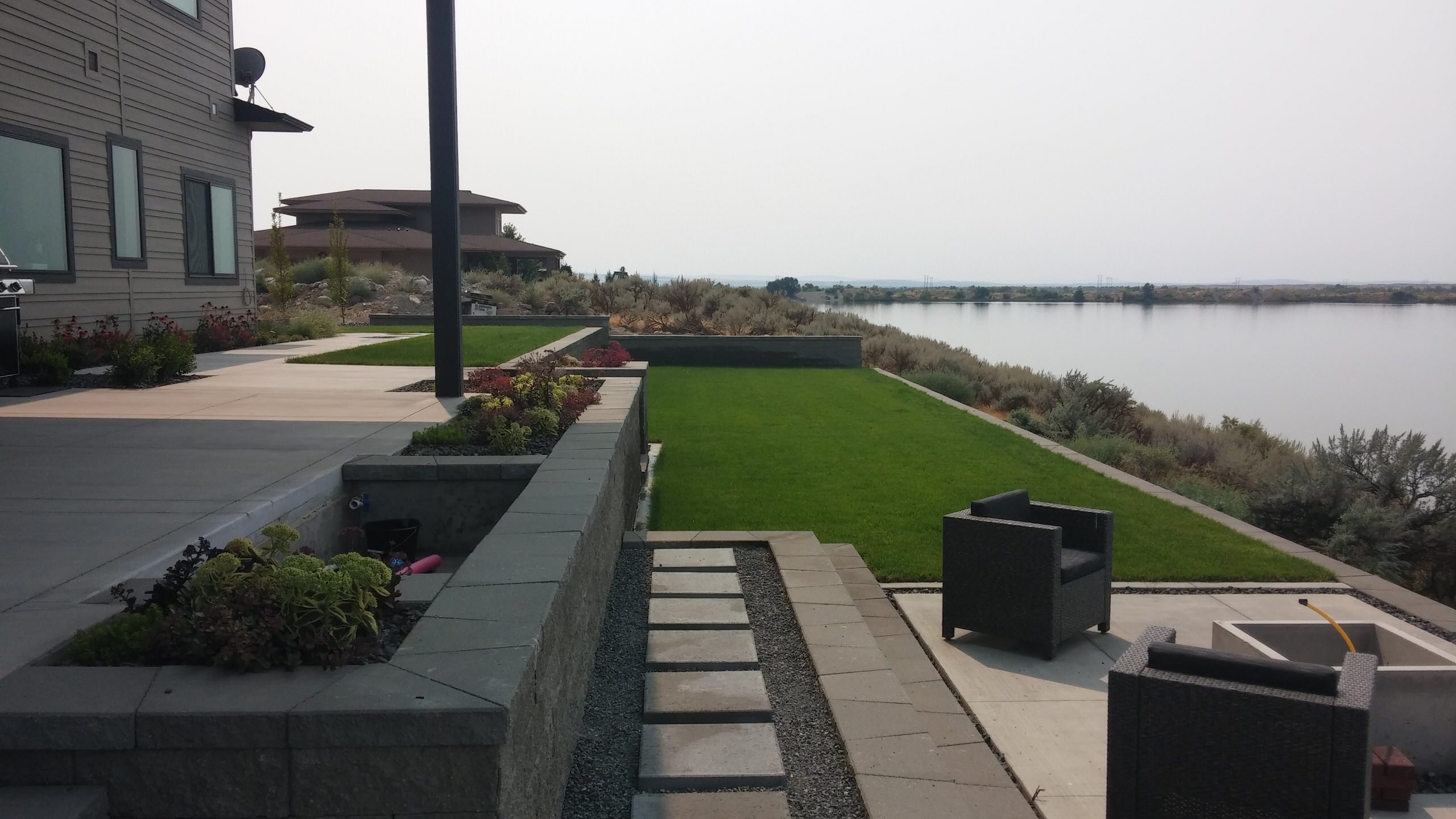 Linear garden terraces with lake view, fire pit, and recycling water urn fountain (under construction)