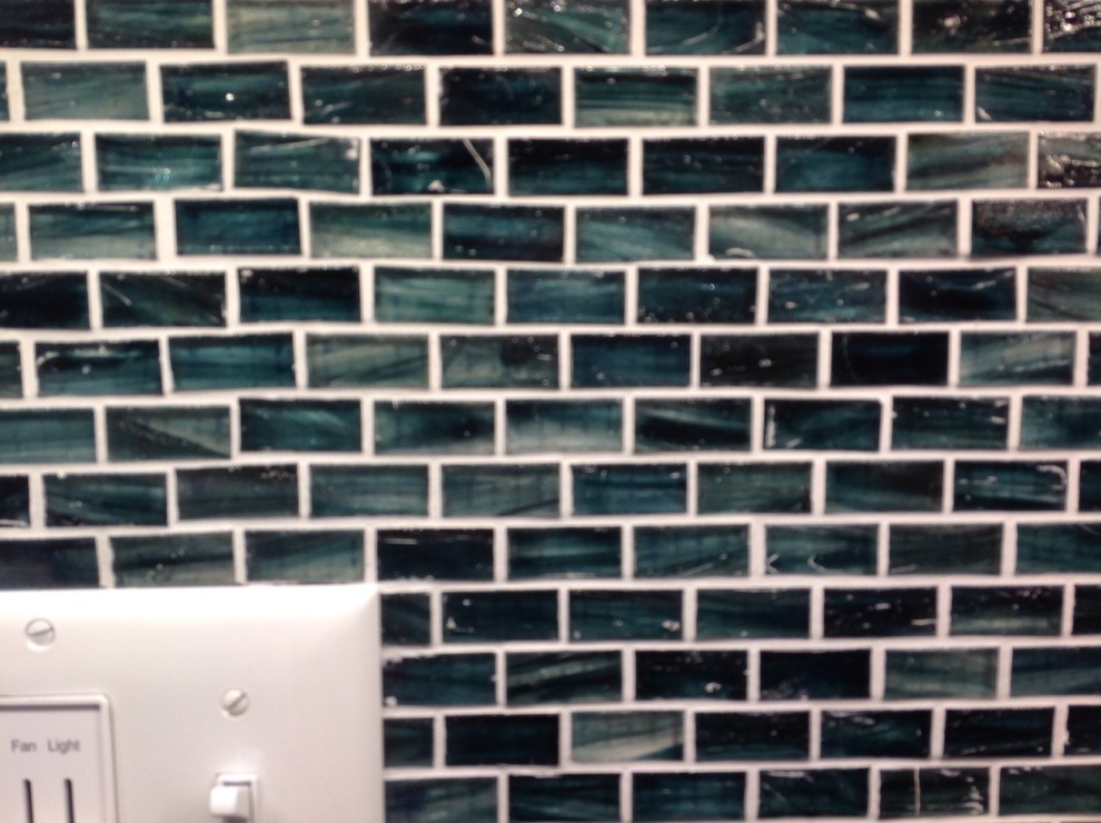 Removing excess grout from glass tile