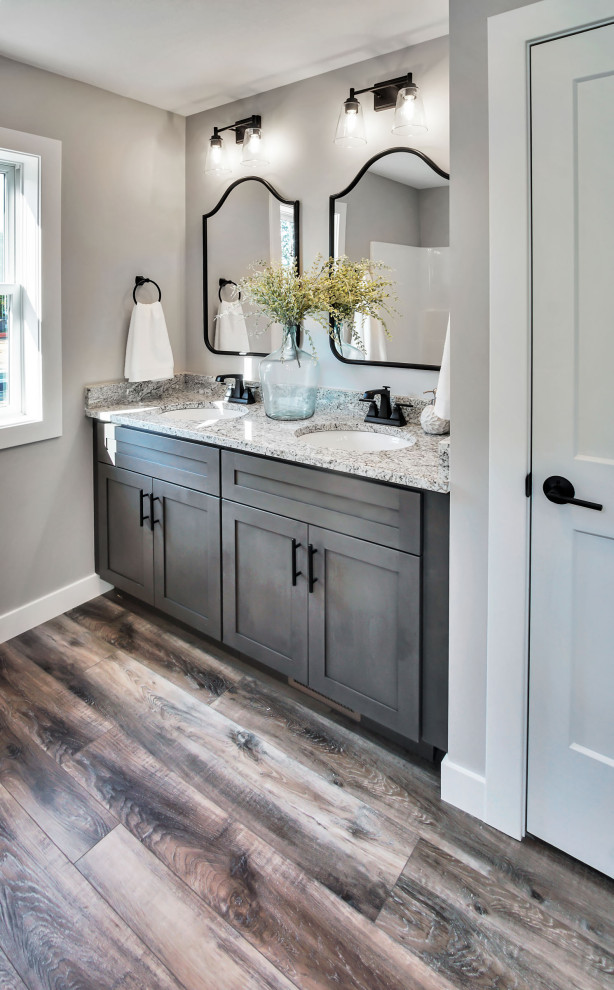 Bathroom - mid-sized farmhouse master vinyl floor, multicolored floor and double-sink bathroom idea in Other with shaker cabinets, medium tone wood cabinets, a two-piece toilet, gray walls, an undermount sink, quartzite countertops, white countertops and a built-in vanity